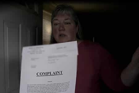 Complaint with a woman looking surprised